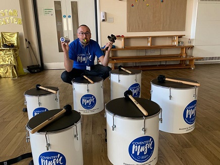 Mark Steele playing samba instruments